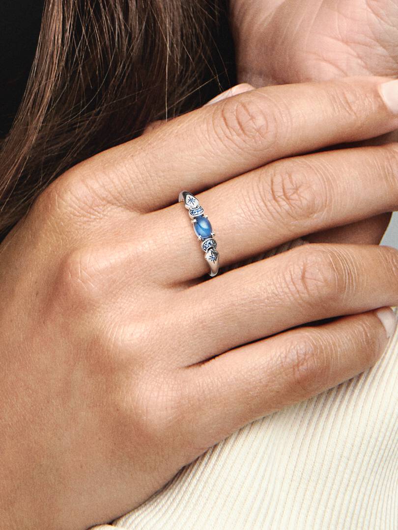 Jasmine-inspired ring with a blue center stone, crescent moons and stars (view 5)